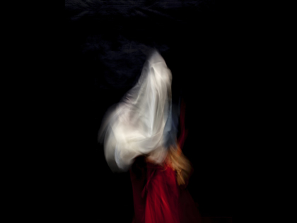 A painting of a person in red wearing a white veil. 