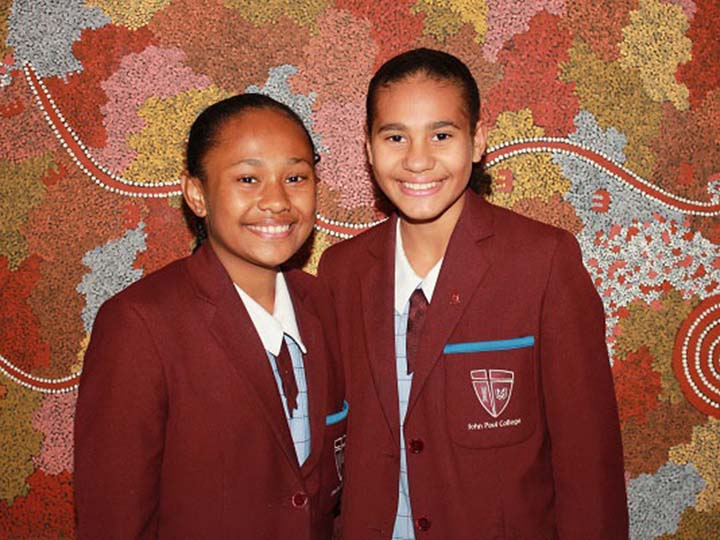 Two school children in uniform benefitting from Yalari's work.