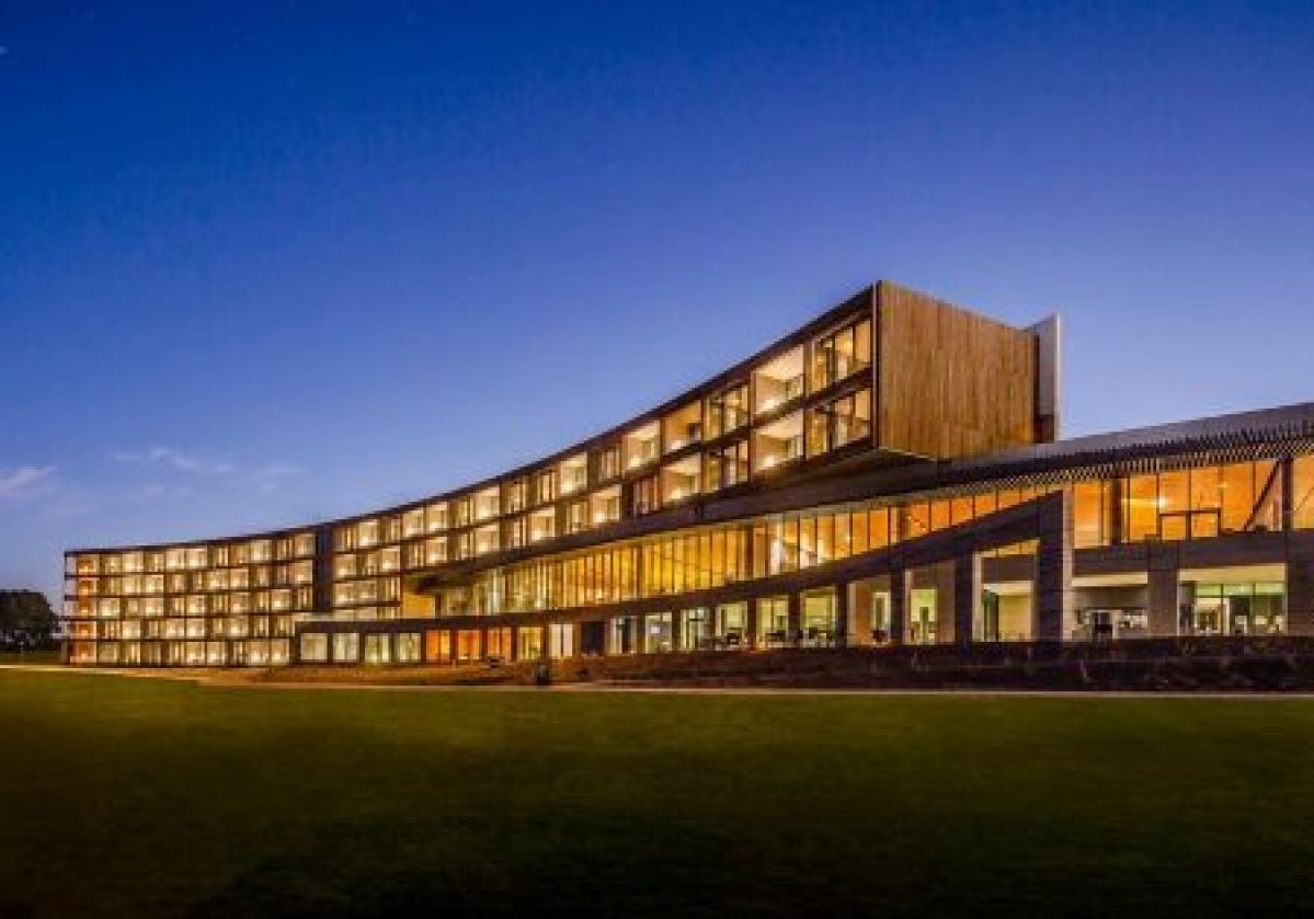 RACV Torquay Resort with all the lights on at dusk