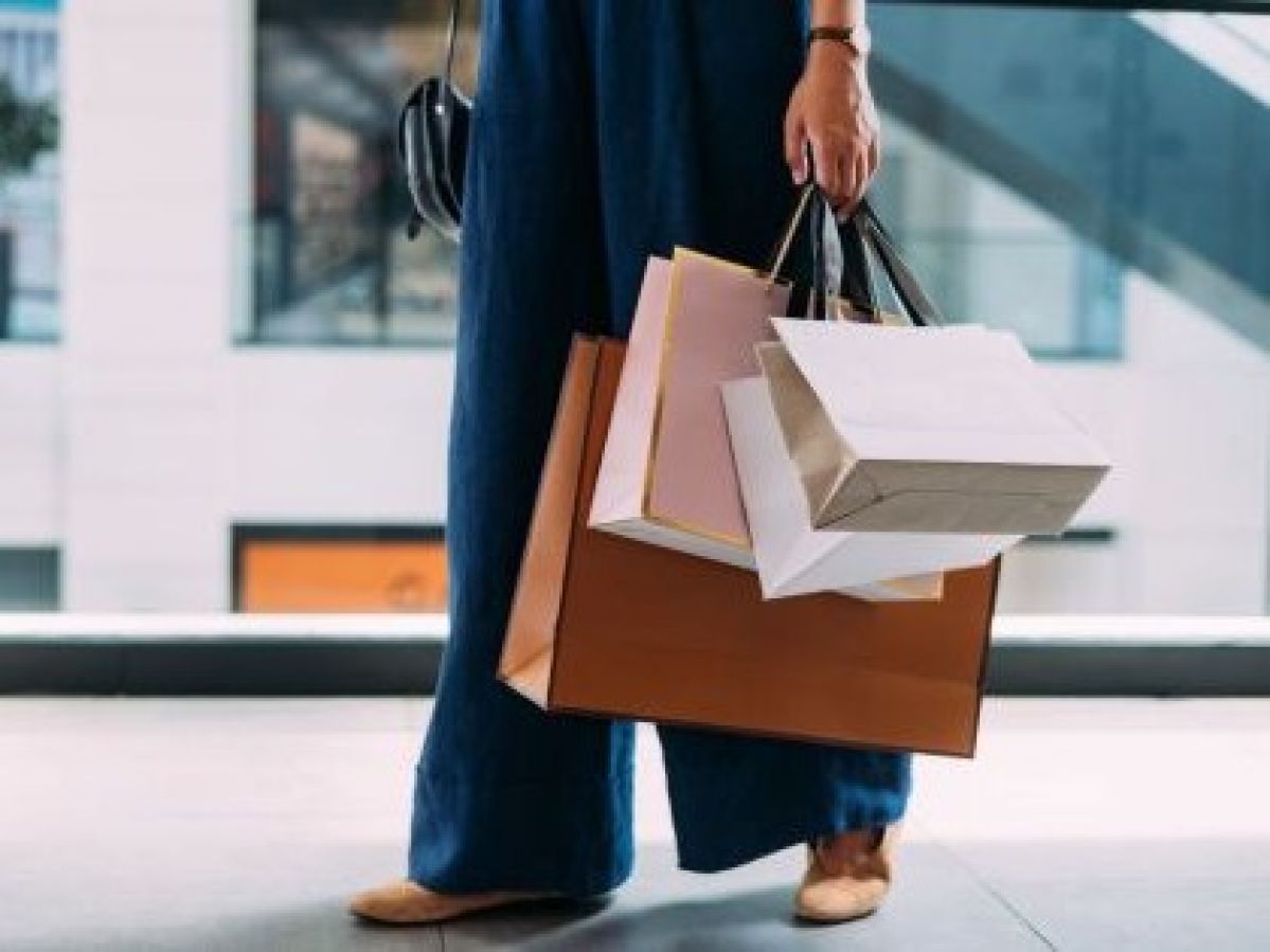 A woman holding multiple shopping bags