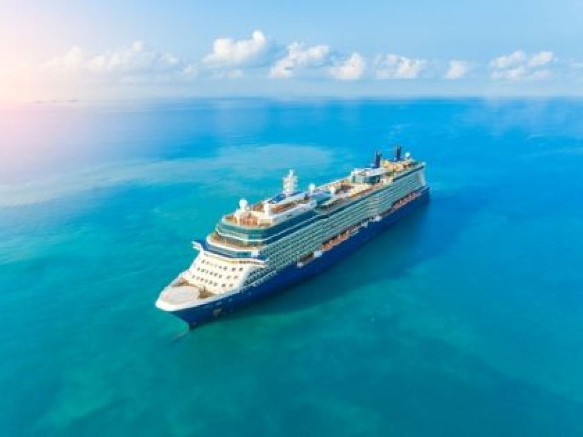 Cruise ship sailing on ocean.
