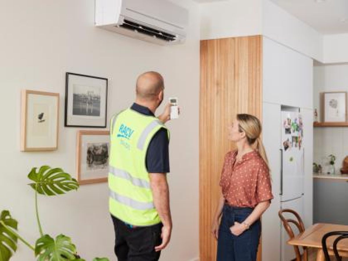 Electrician talking to customer