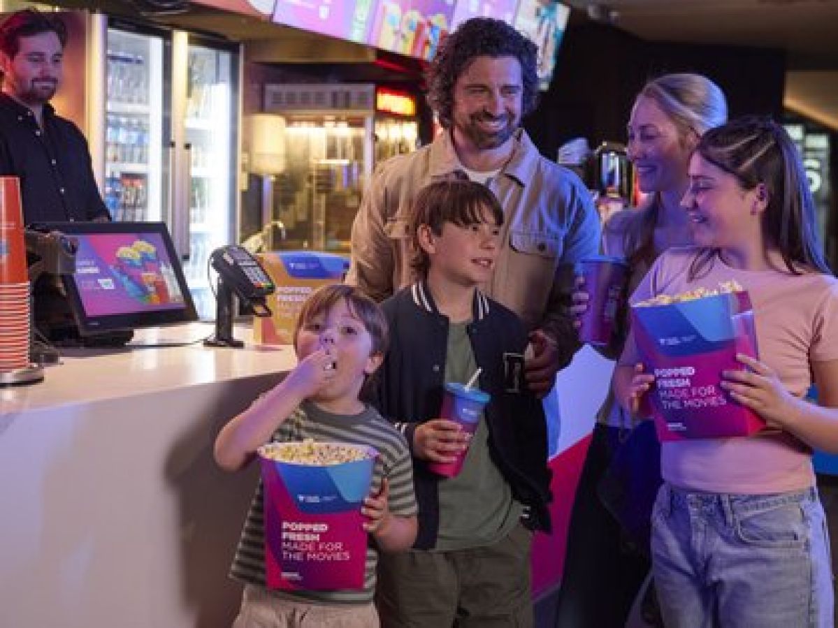 Family buying tickets for a movie