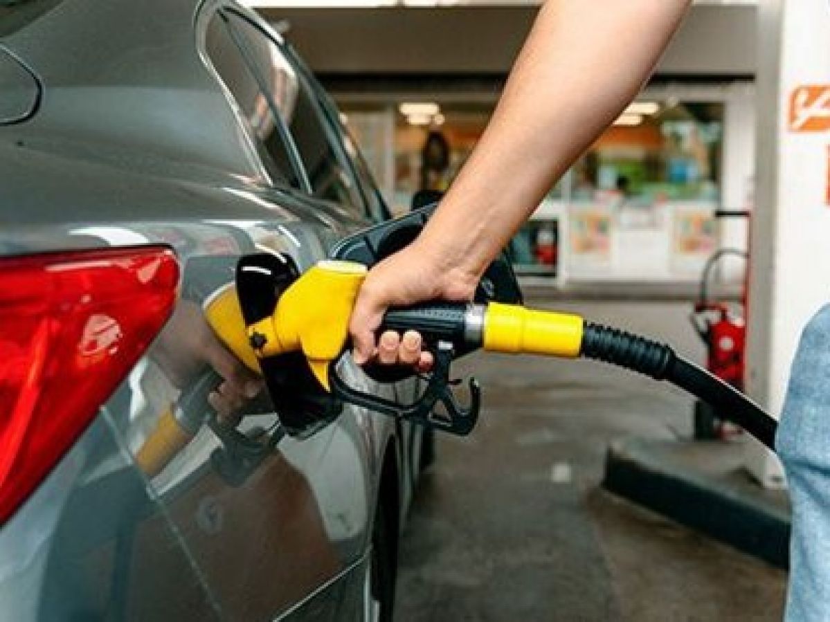 Someone putting petrol into car