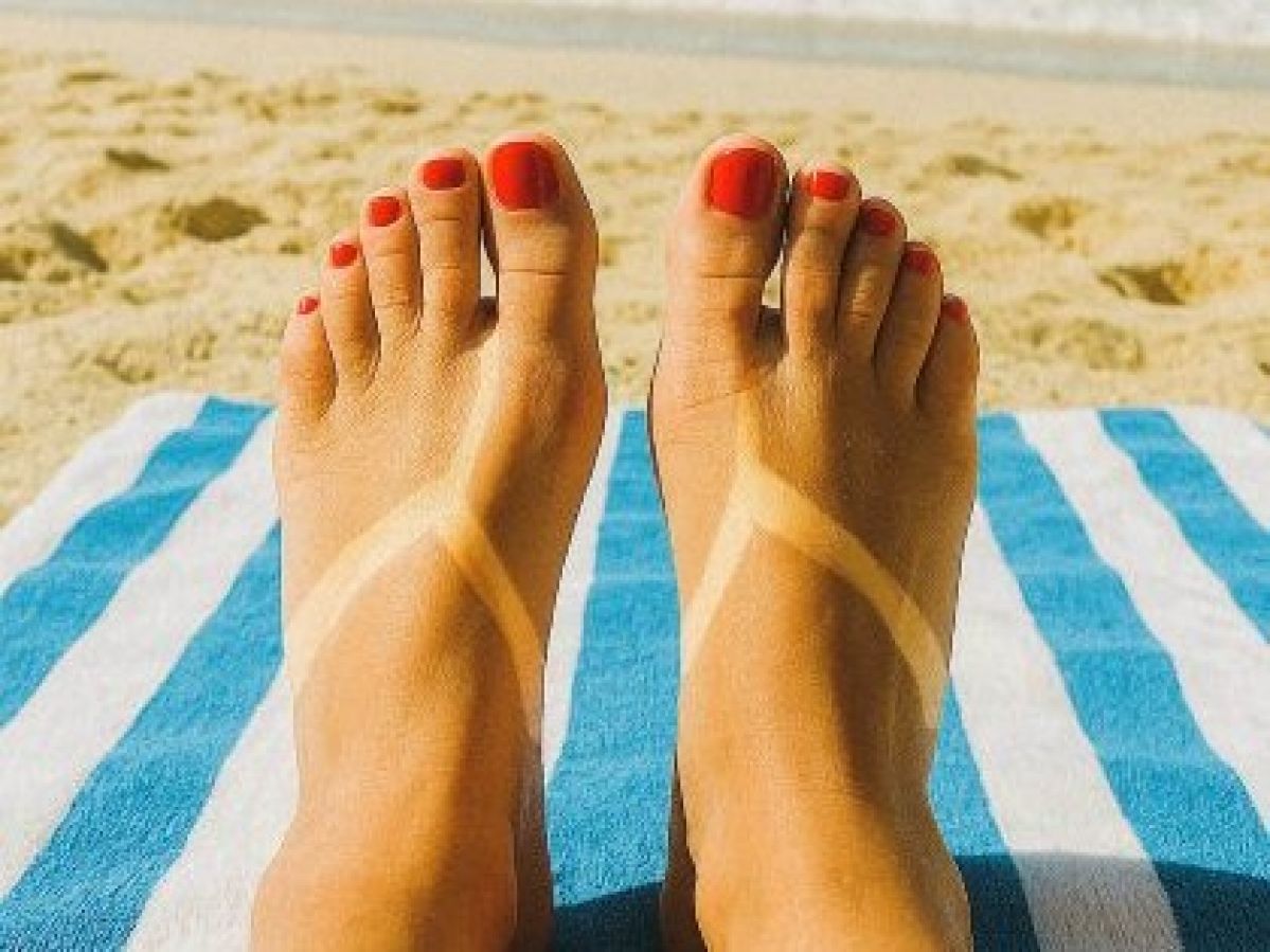 feet tan line at beach