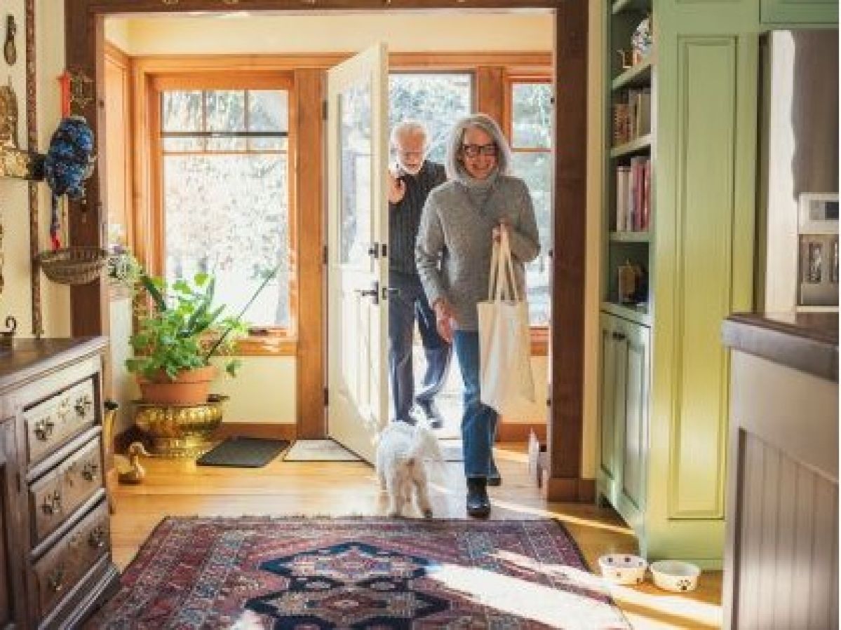 Couple return home after shopping.