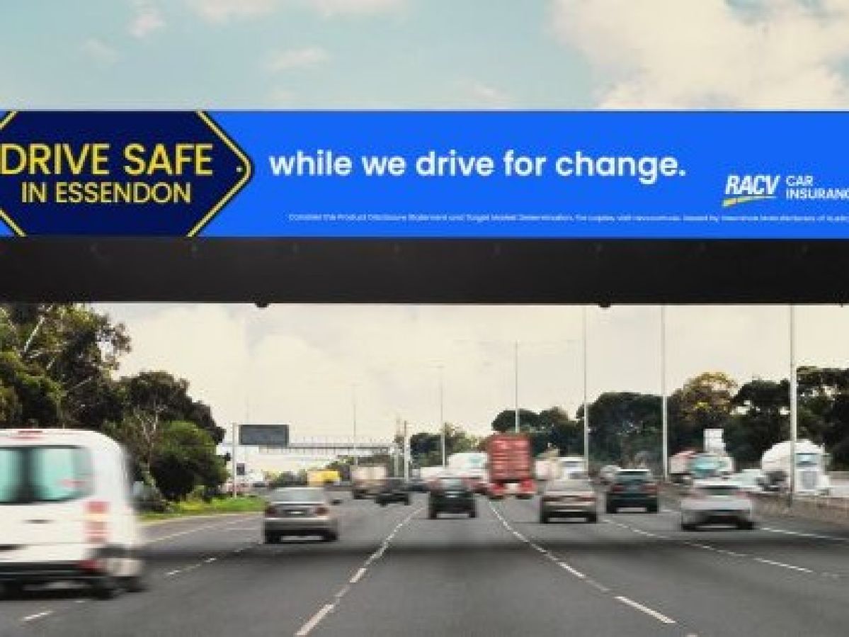 cars on road with RACV billboard