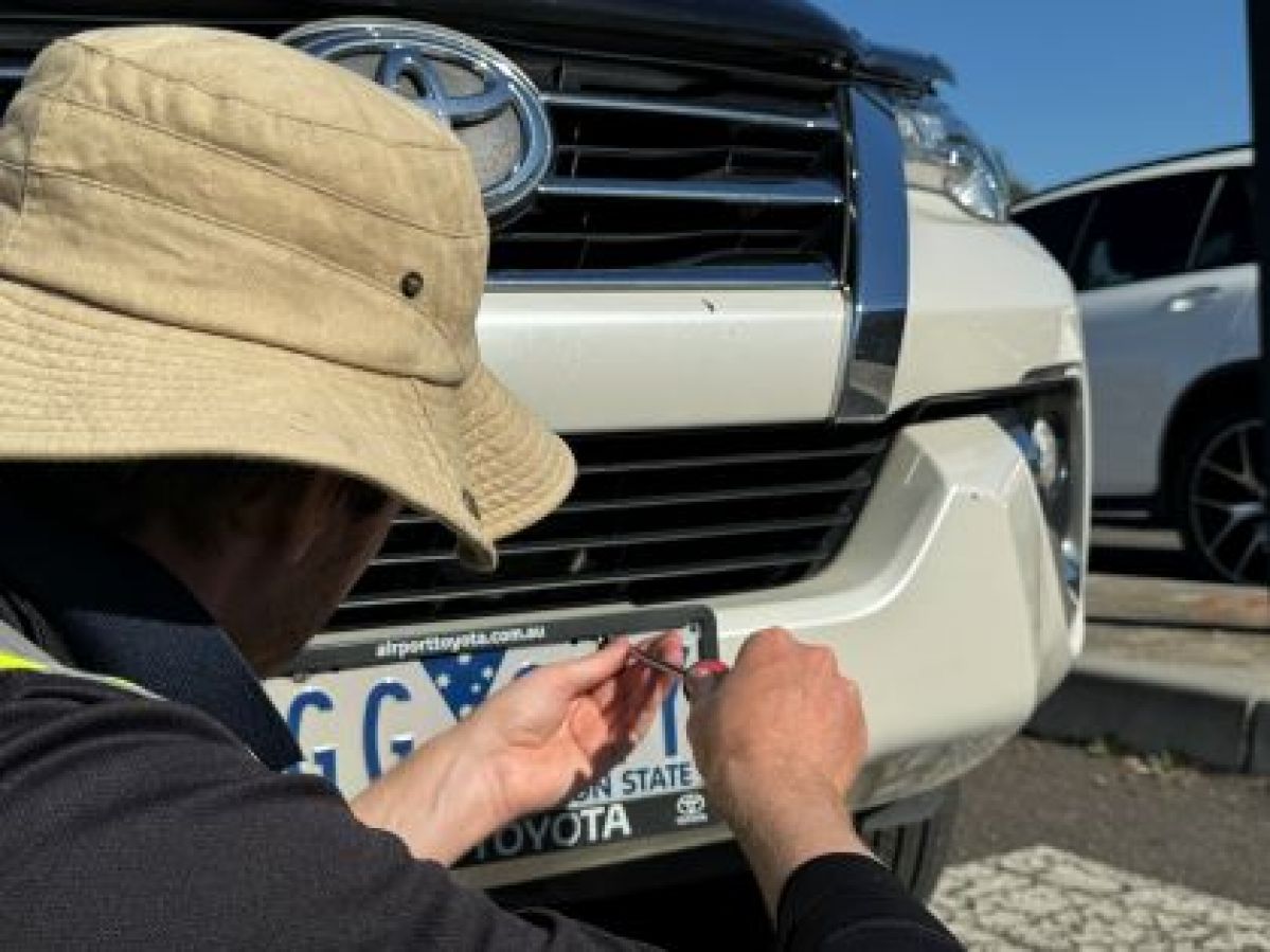 Car owner installs anti-theft number plate screws