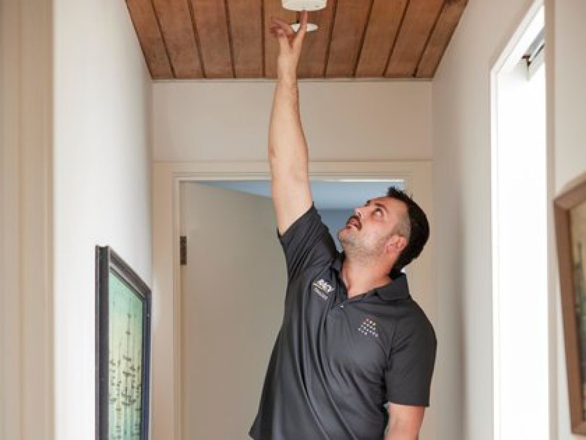 RACV trade person does smoke alarm check