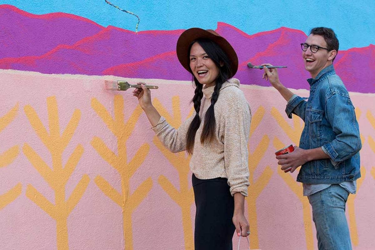 couple volunteer painting