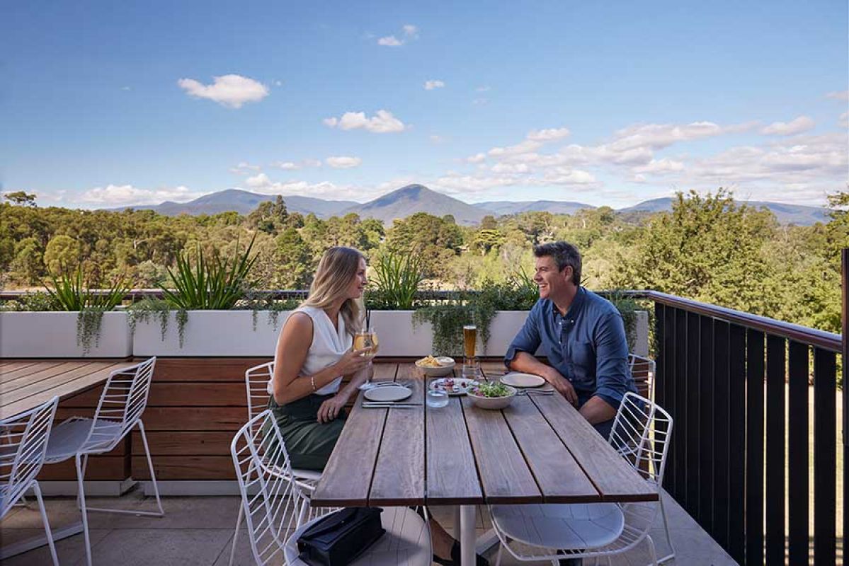 Couple eating and drinking in a restaurant in Healesville