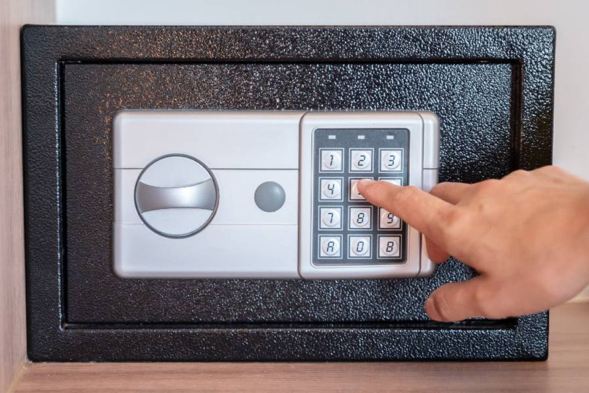 person unlocking a home safe