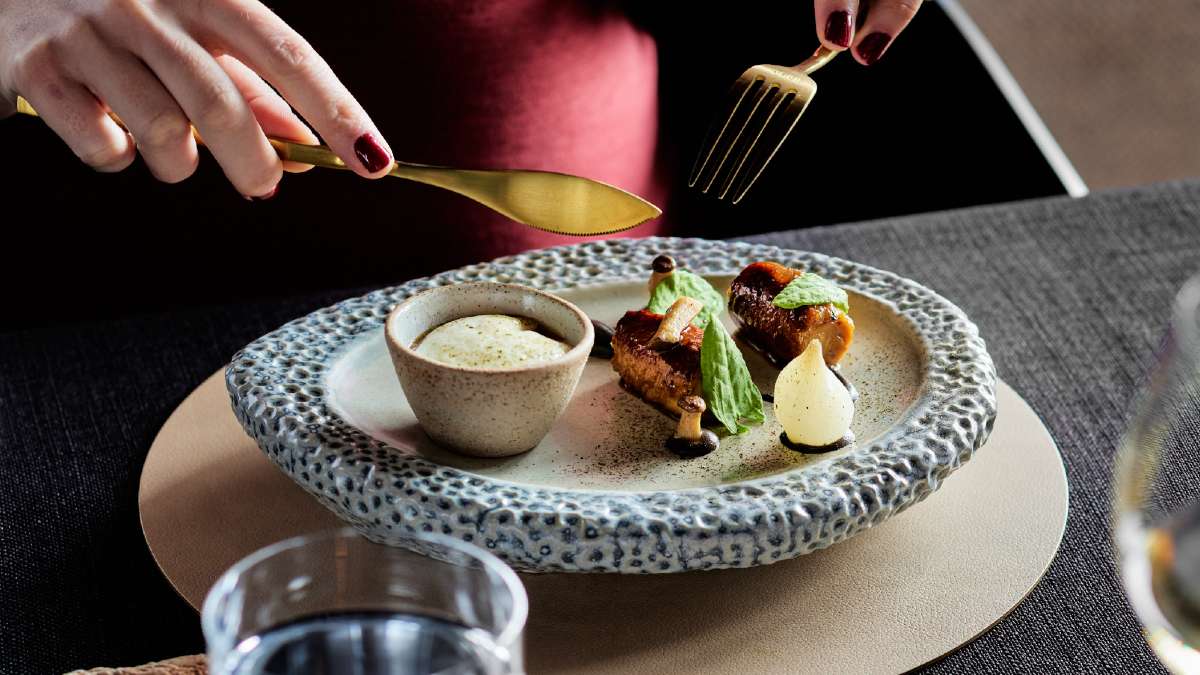 white wine next to a plate of food