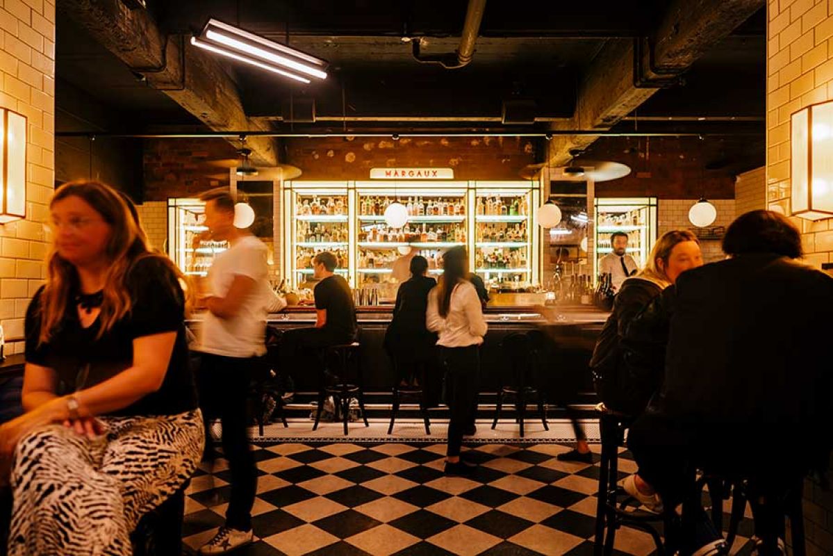 People enjoying a drink at the bar iof Bar Margaux in Melbourne CBD