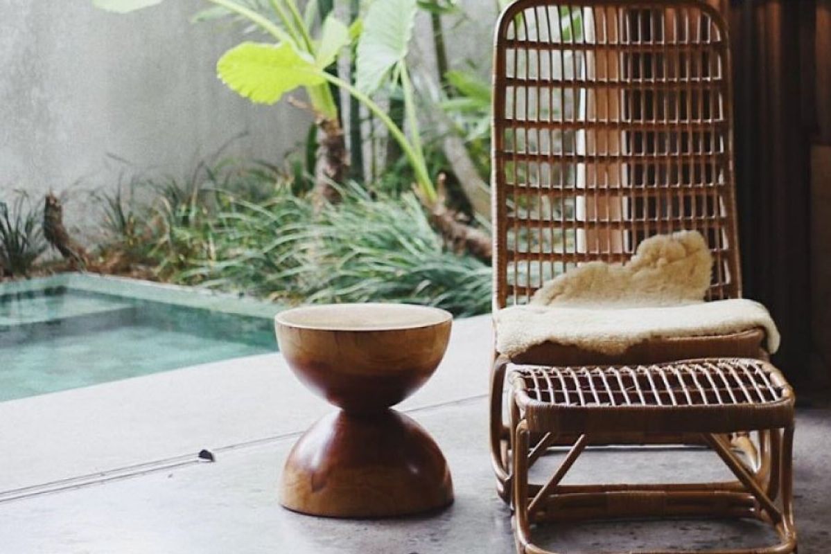 wooden chair and stool near pool