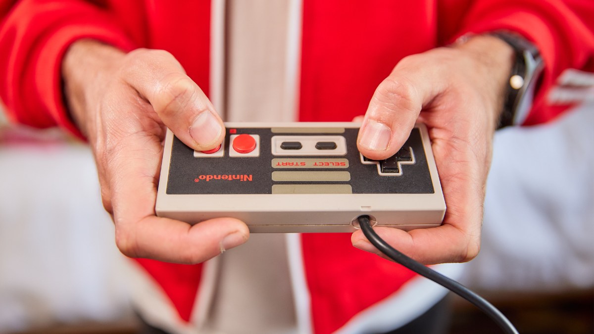 man playing on Nintendo console