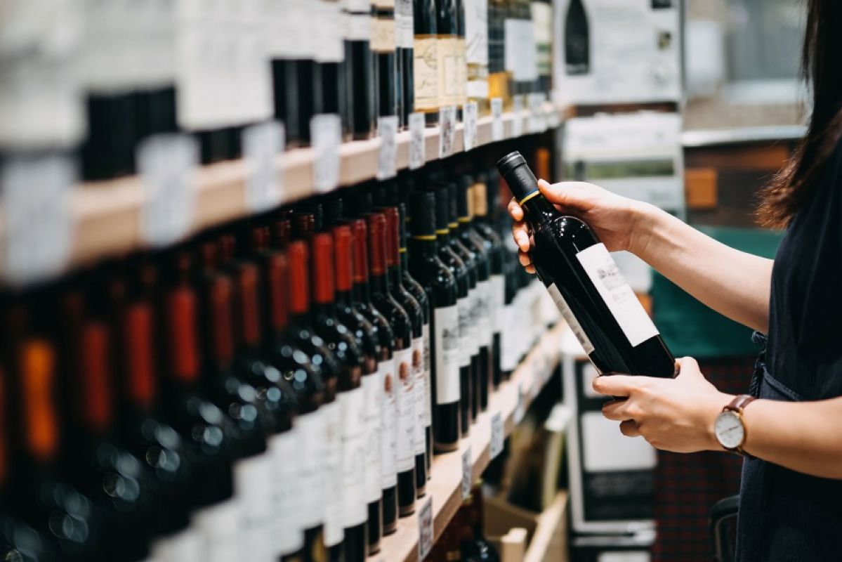 Choosing wine at a bottle shop
