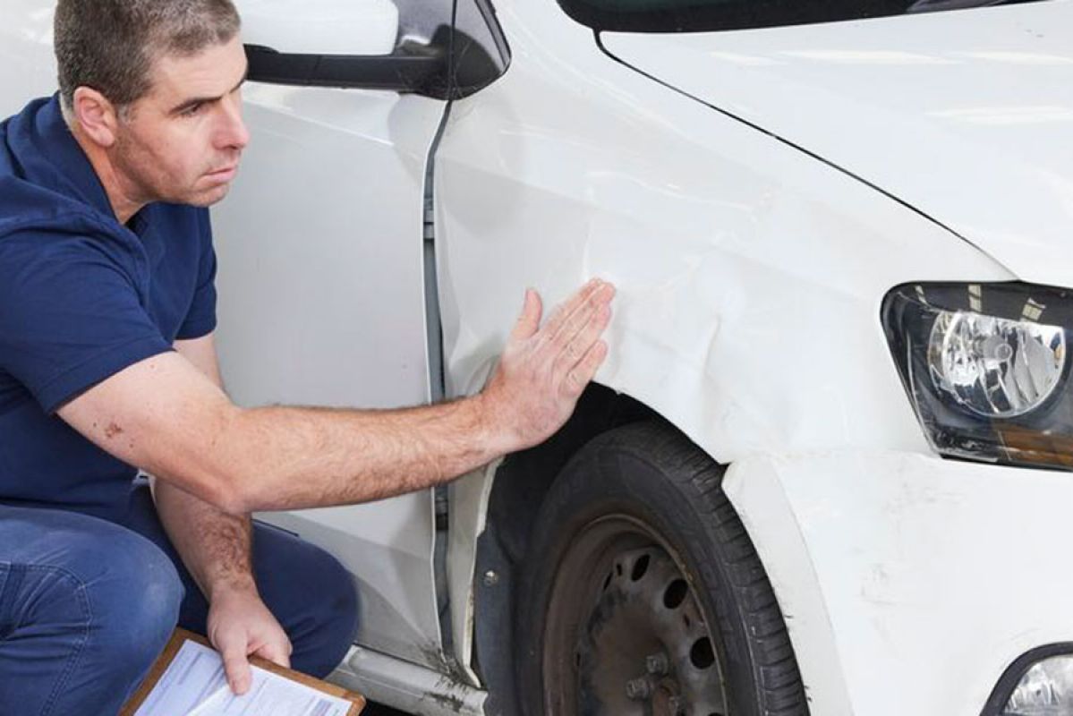Taking photo of damage to car