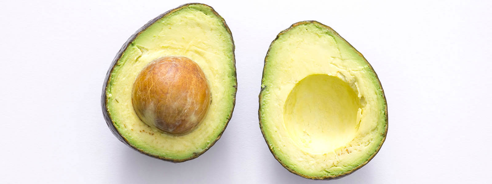 fresh Hass avocado cut in half