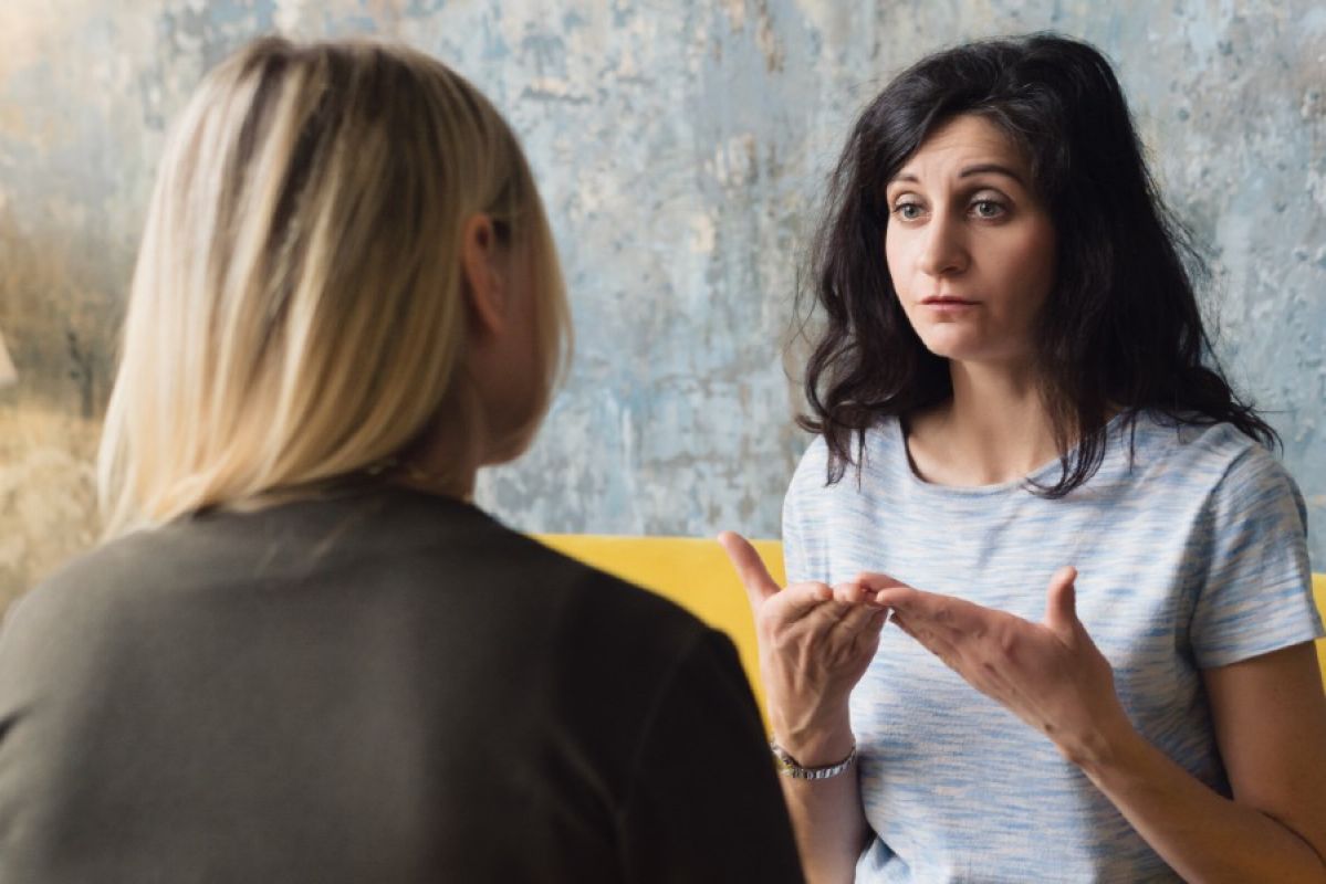 two women speaking to each other about mental health