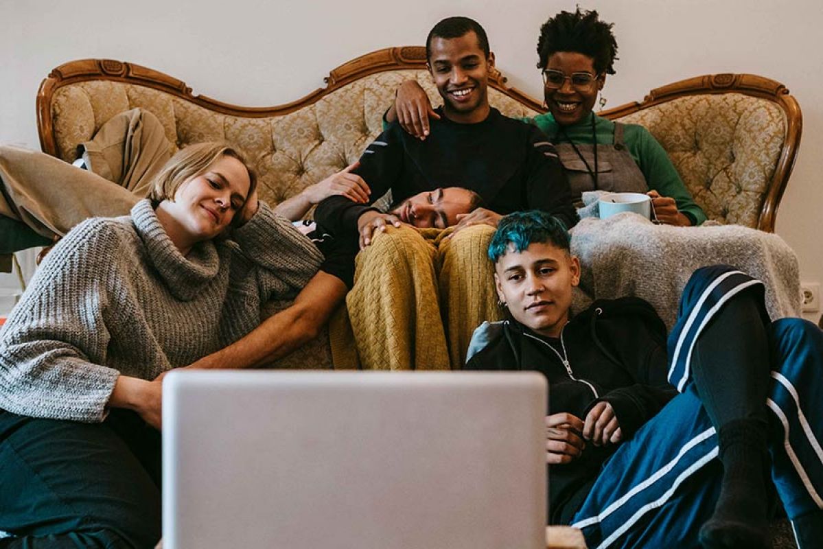 People sitting in front of a laptop