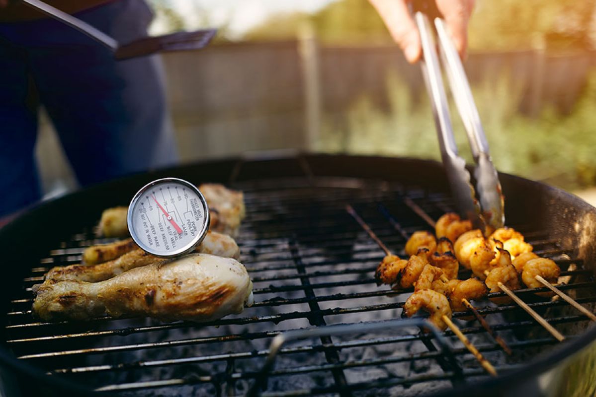 meat on barbecue grill with thermometre