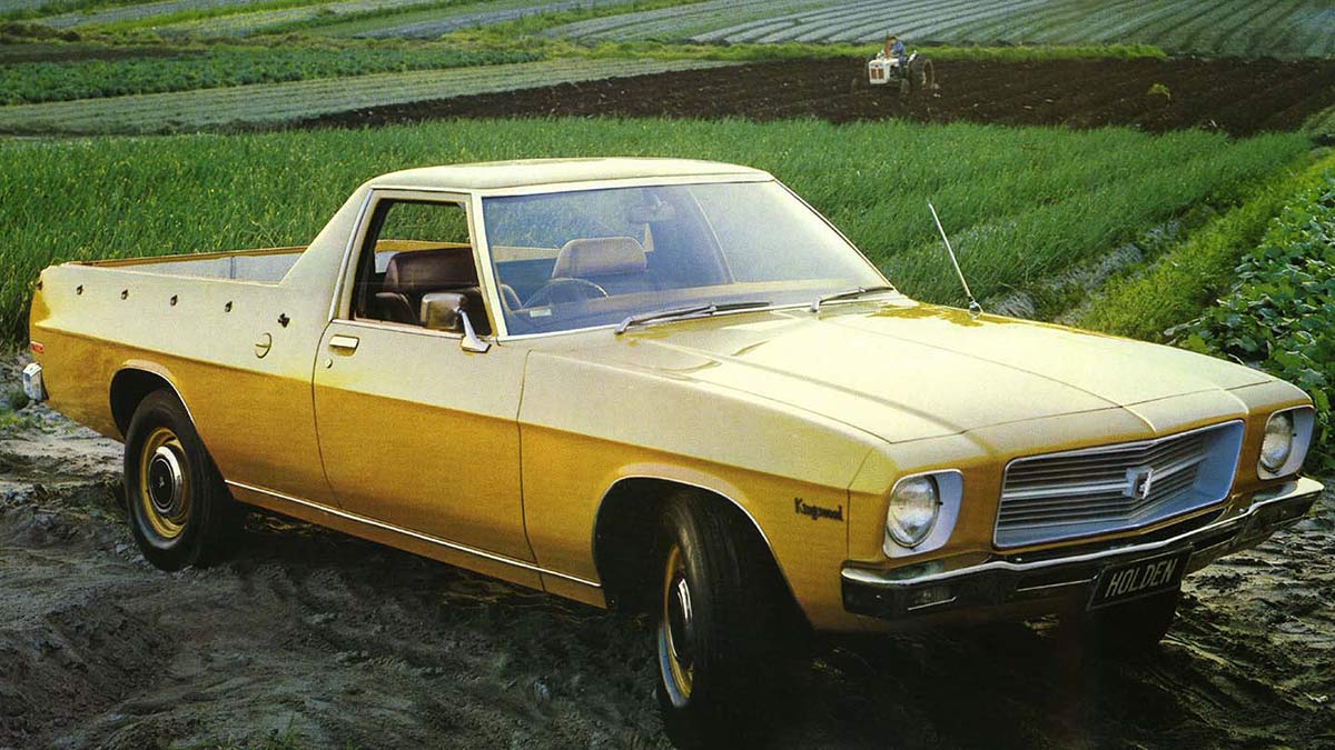 Yellow Holden HQ ute in a green field