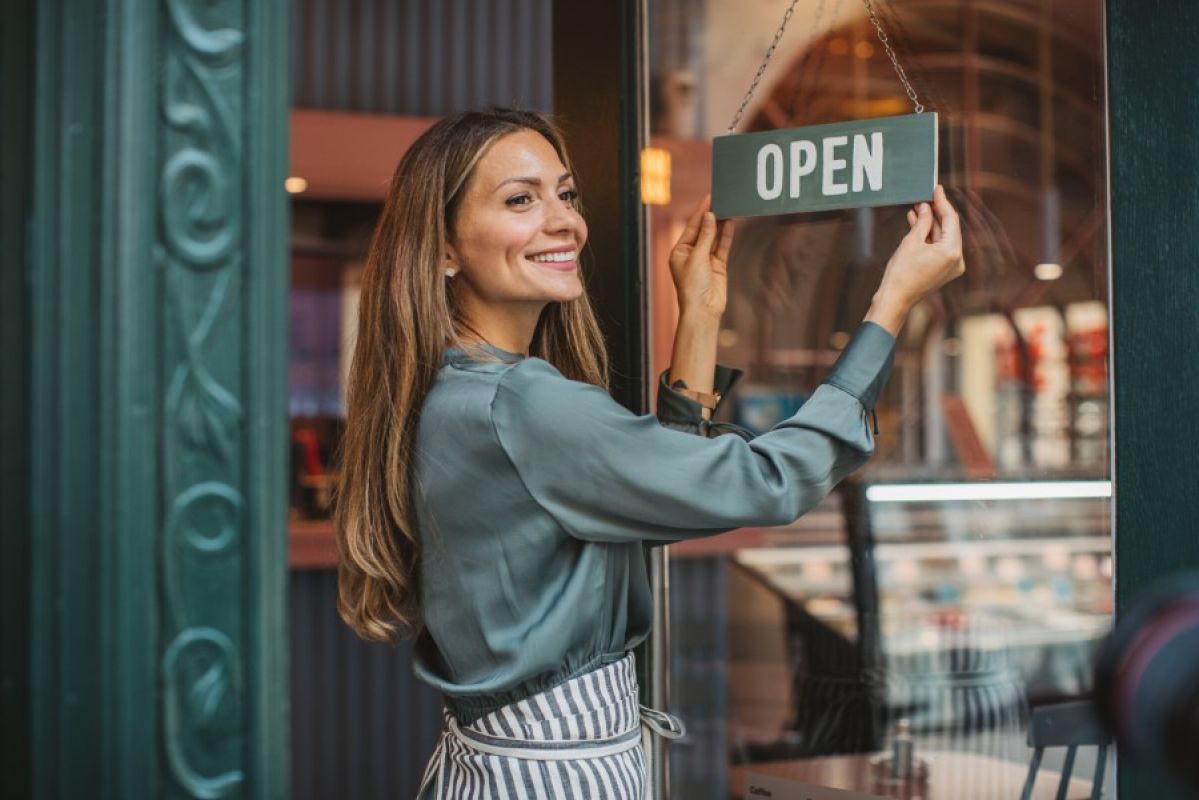 woman opening her small business