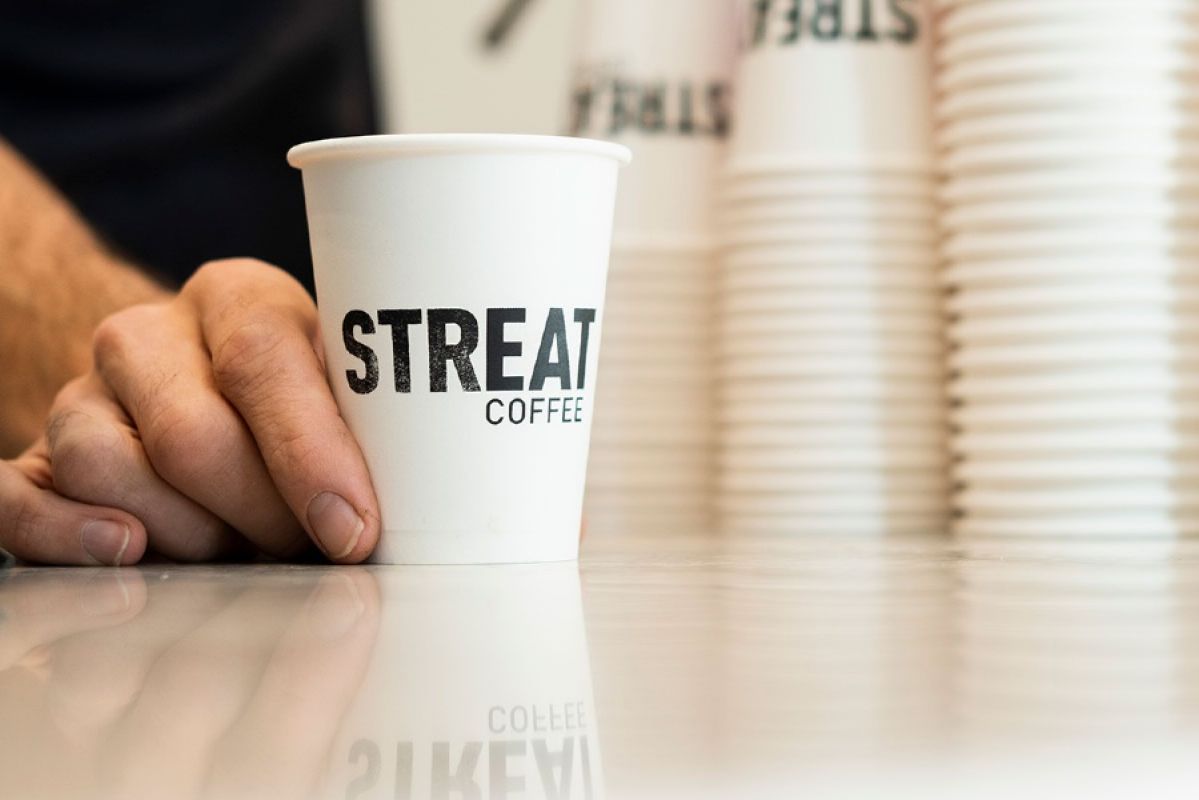 Streat coffee cup on bench