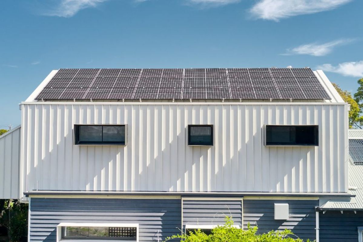 house with rooftop solar panels