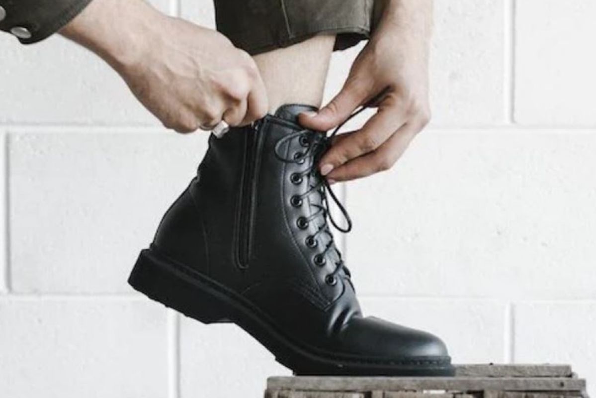 man wearing vegan leather boots