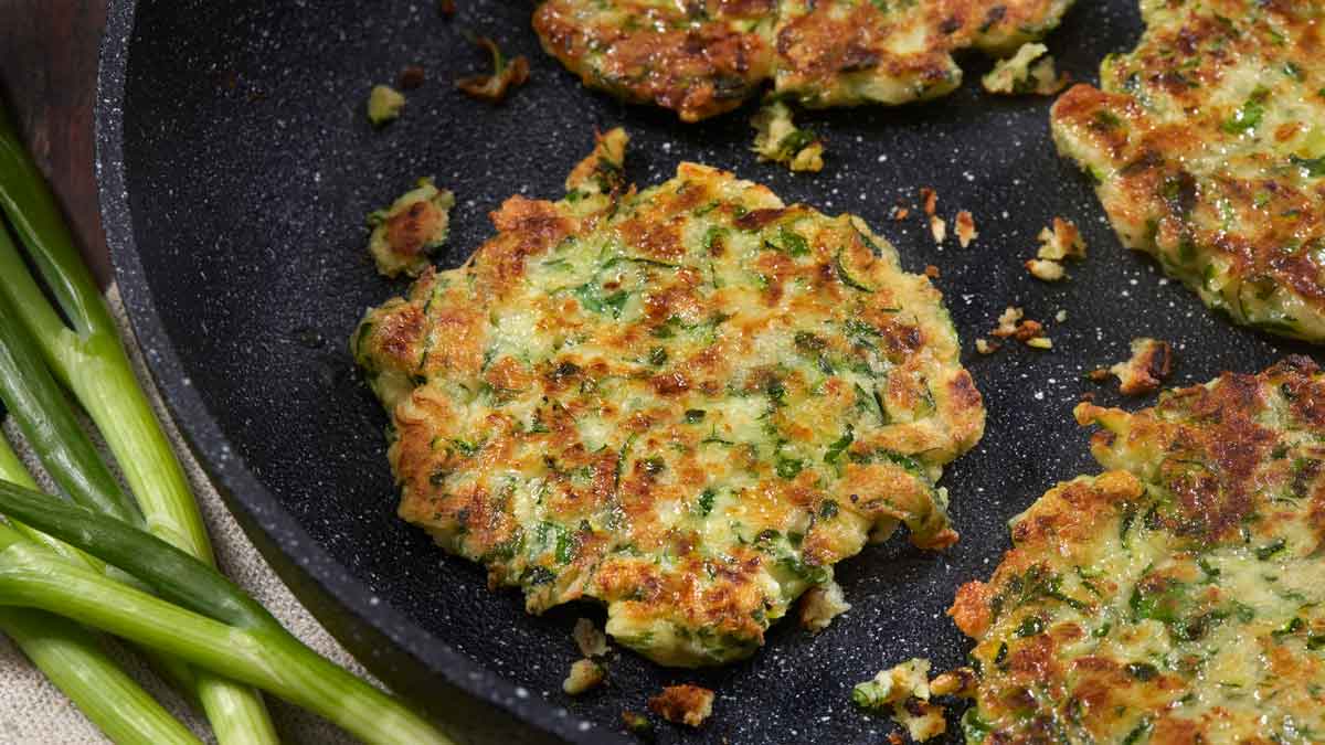 Frying fritters in pan. 