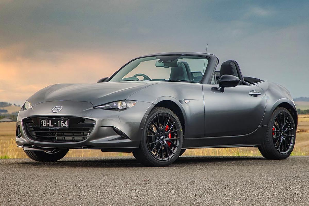 A Mazda MX-5 convertible parked with the top down.