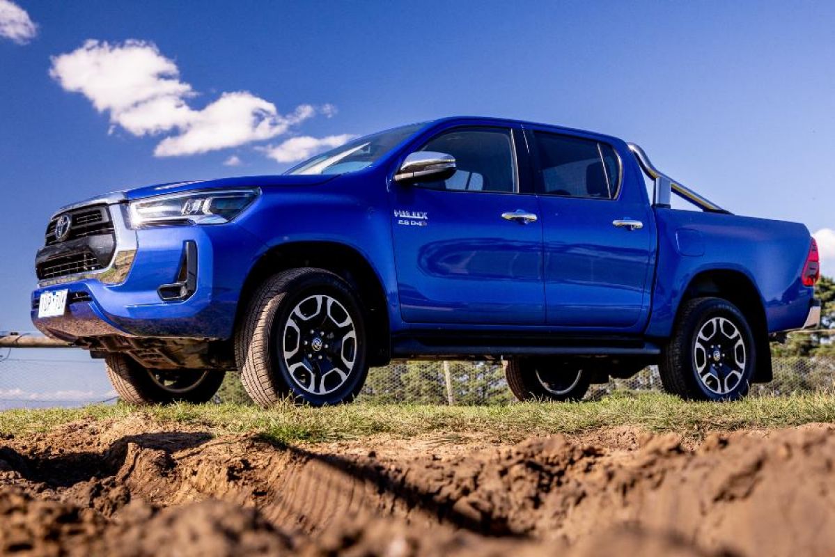 blue Hilux parked off-road