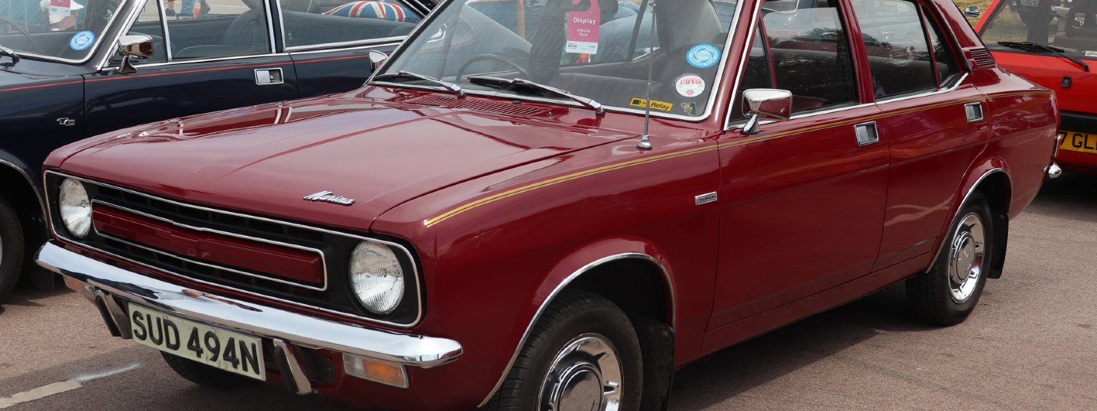 burgundy coloured leyland marina six in parking lot