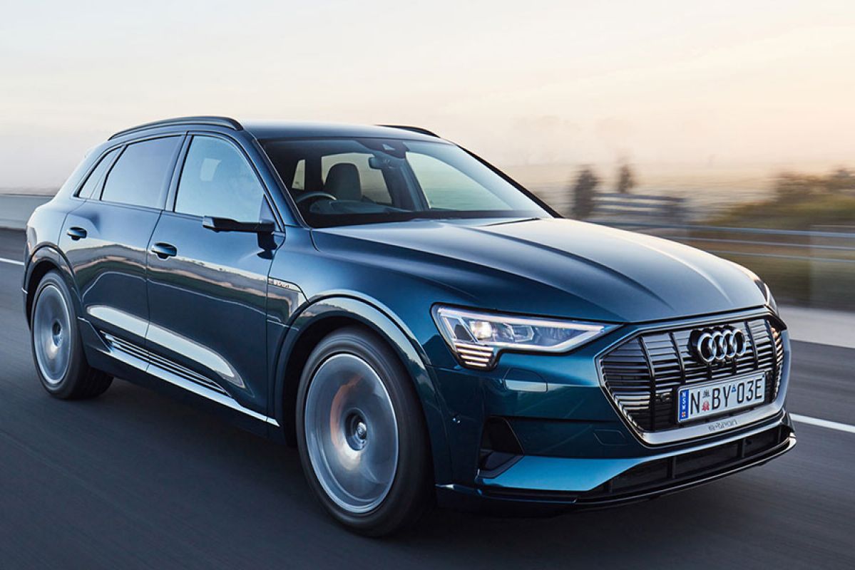 Blue Audi e-tron 50 quattro driving on road 