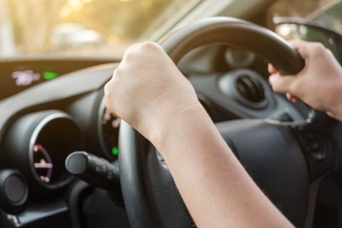 Hands on a steering wheel
