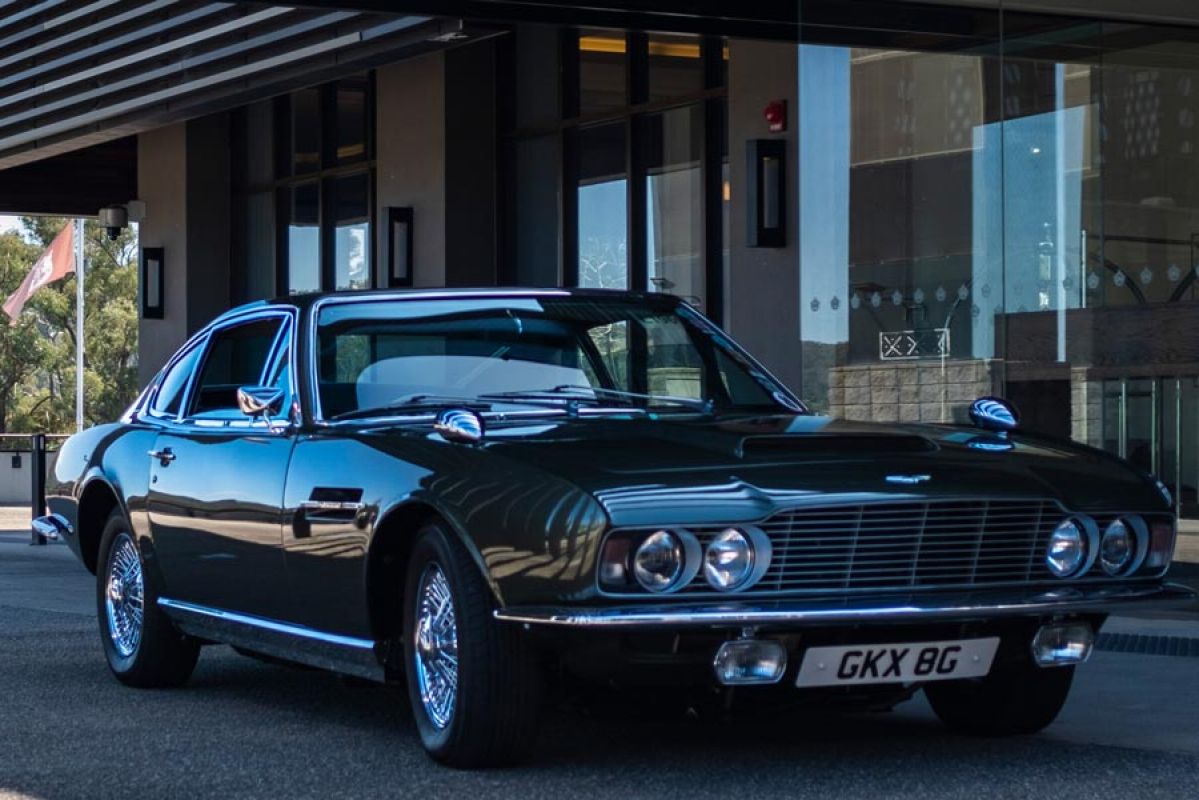 1968 aston martin parked outside