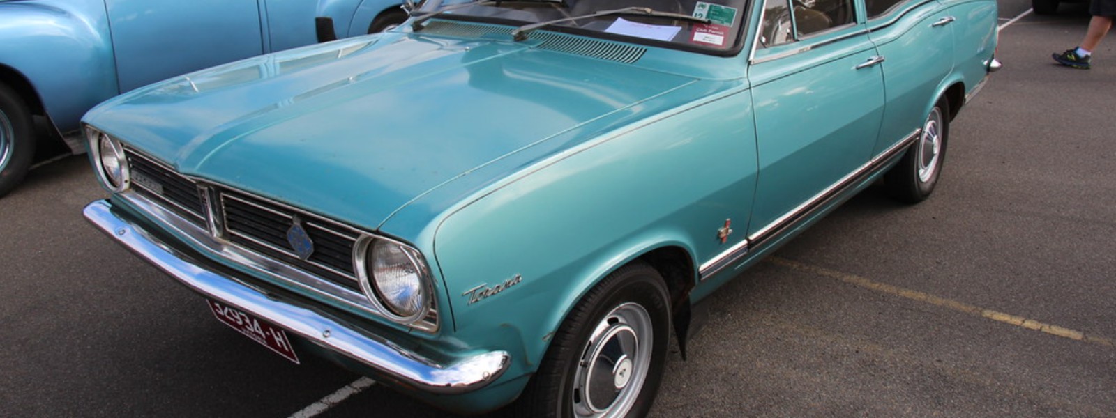 light blue holden hb torana parked in parking lot