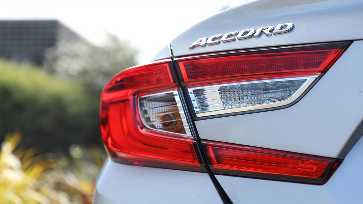Close up of the rear of a silver Honda Accord VTi-LX 2020 Hybrid showcasing the taillight and Accord badge