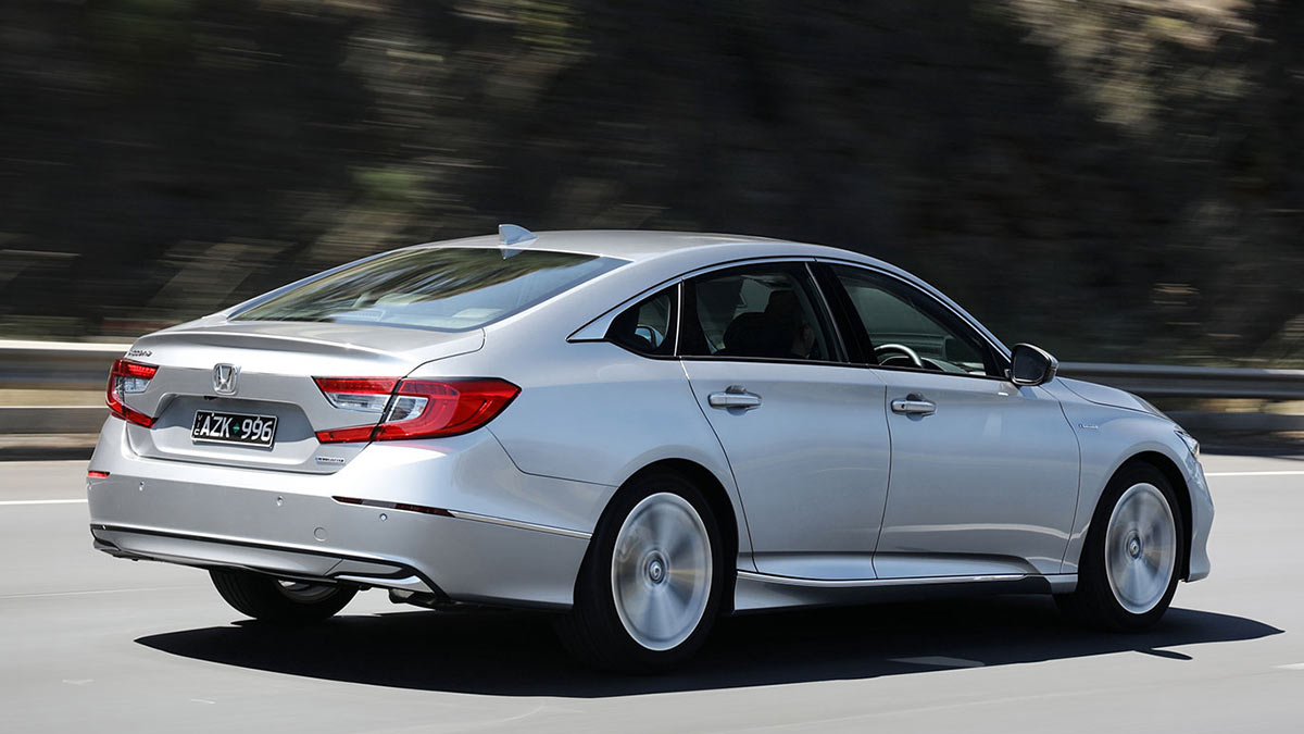 Rear side view of a silver Honda Accord VTi-LX 2020 Hybrid car in motion