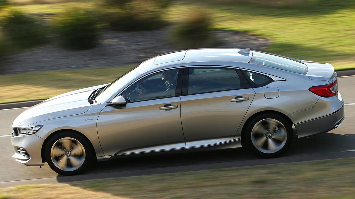 Top side view of a silver Honda Accord VTi-LX 2020 Hybrid car in motion