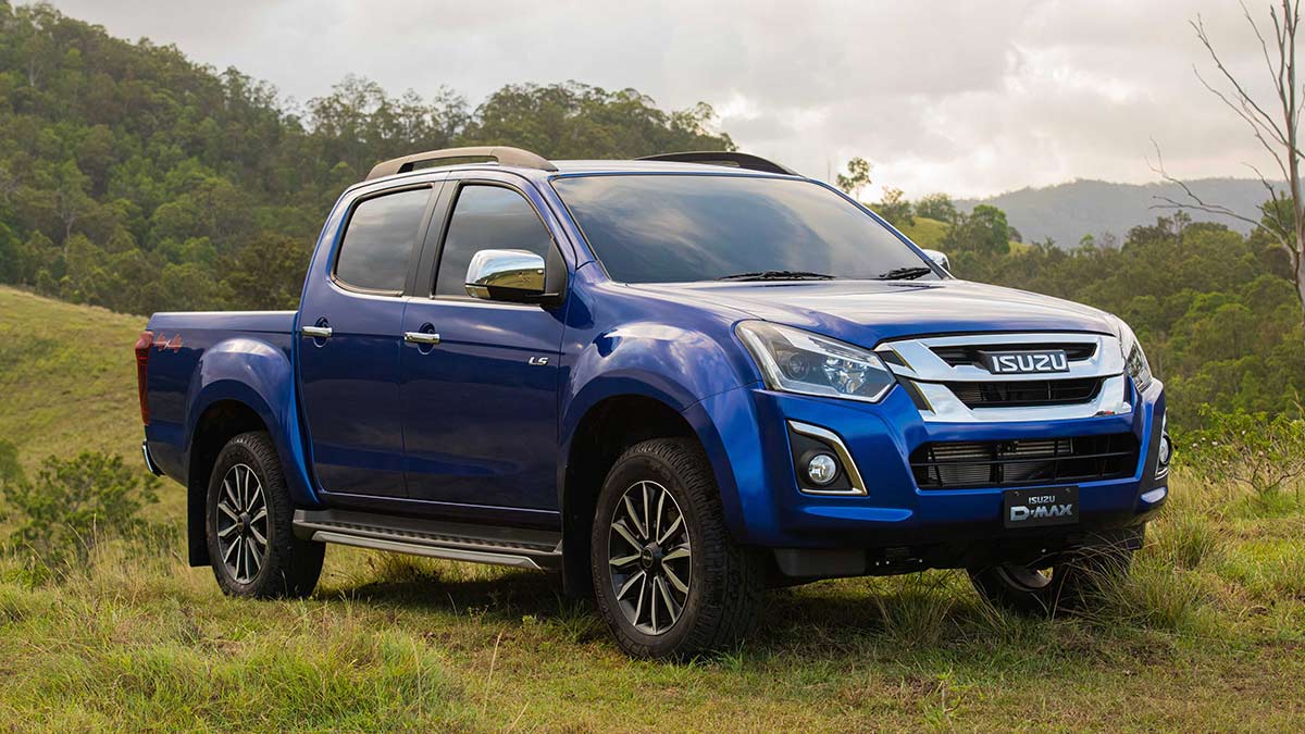 Front side view of a blue Isuzu D-Max 2019 car parked in a country field