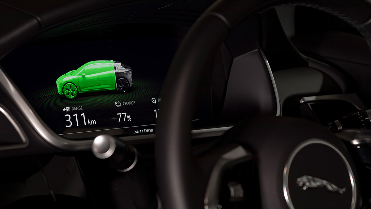 Close up of the instrument panel inside of a Jaguar I-Pace 2019 car showing the charge and range