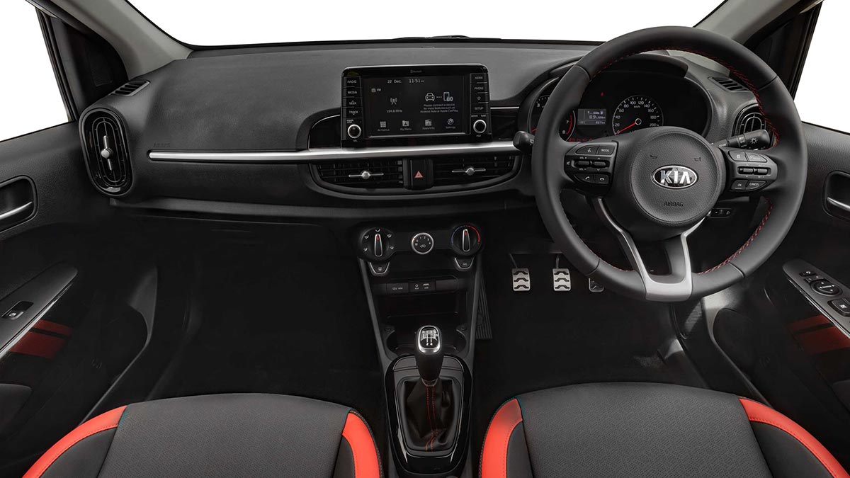 The black interior with red detailing of the Kia Picanto GT 2019 showing the front seats, dashboard and steering wheel