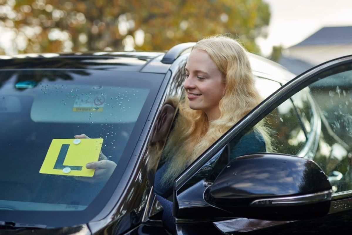learner driver getting into her car