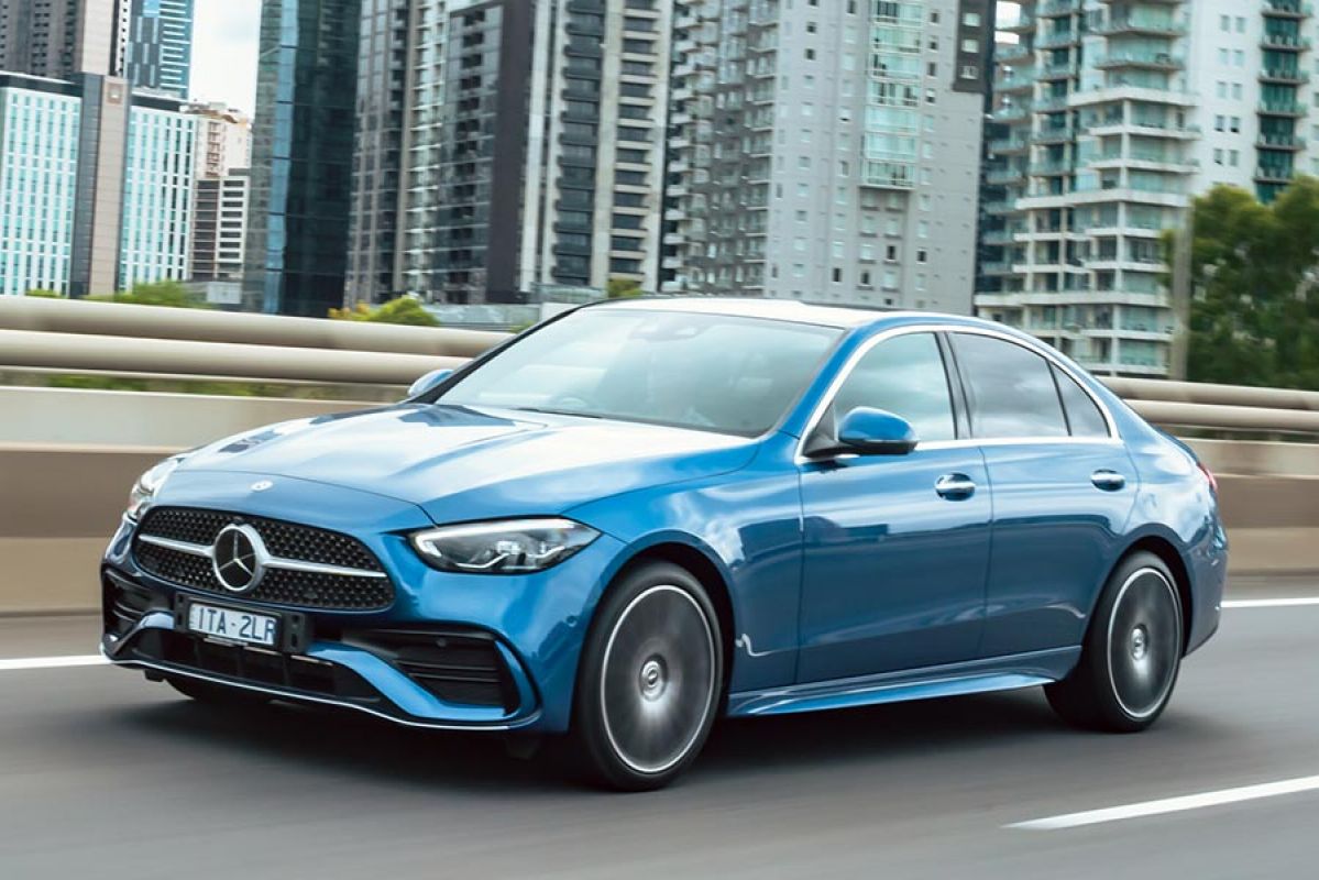 A blue 2022 Mercedes-Benz C-Class on the road.