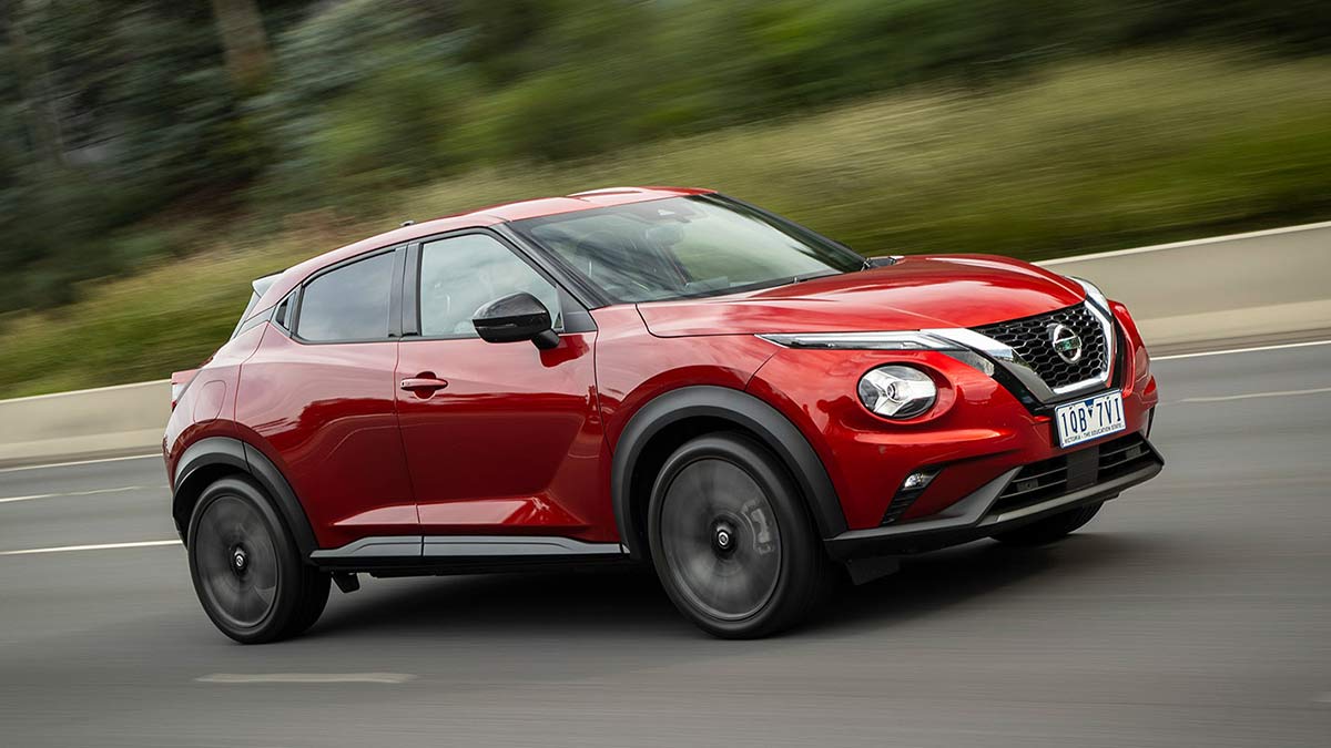 Red Nissan Juke on road
