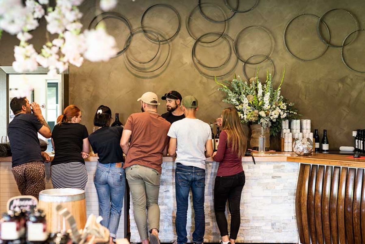 Travellers enjoying wine tasting at Pizzini Wines in Victoria