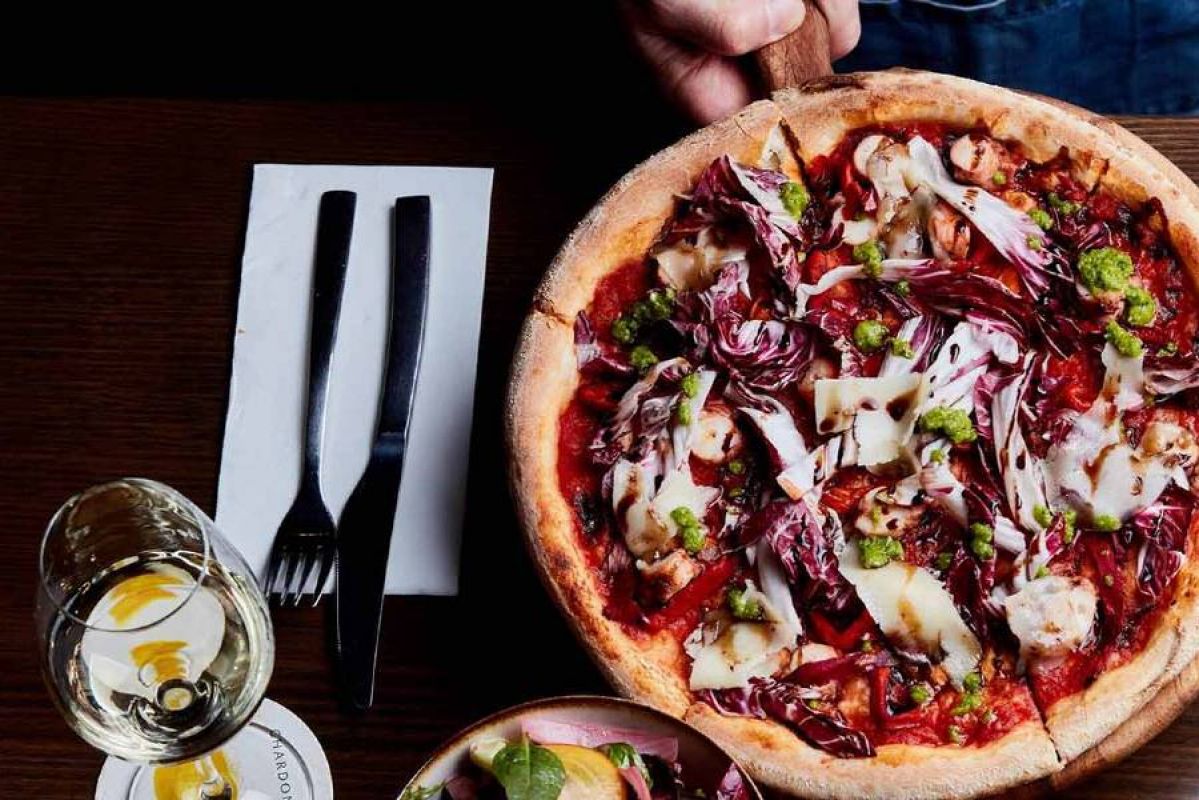 Pizza and wine on a table